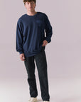 Model wearing full Grateful Dead long sleeve tee in Dark and Stormy Blue.