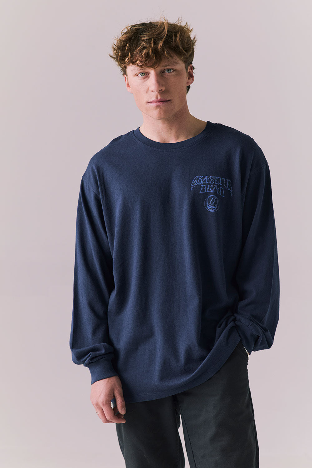 Front view of long sleeve tee in Dark and Stormy Blue with subtle Stealie skull design.