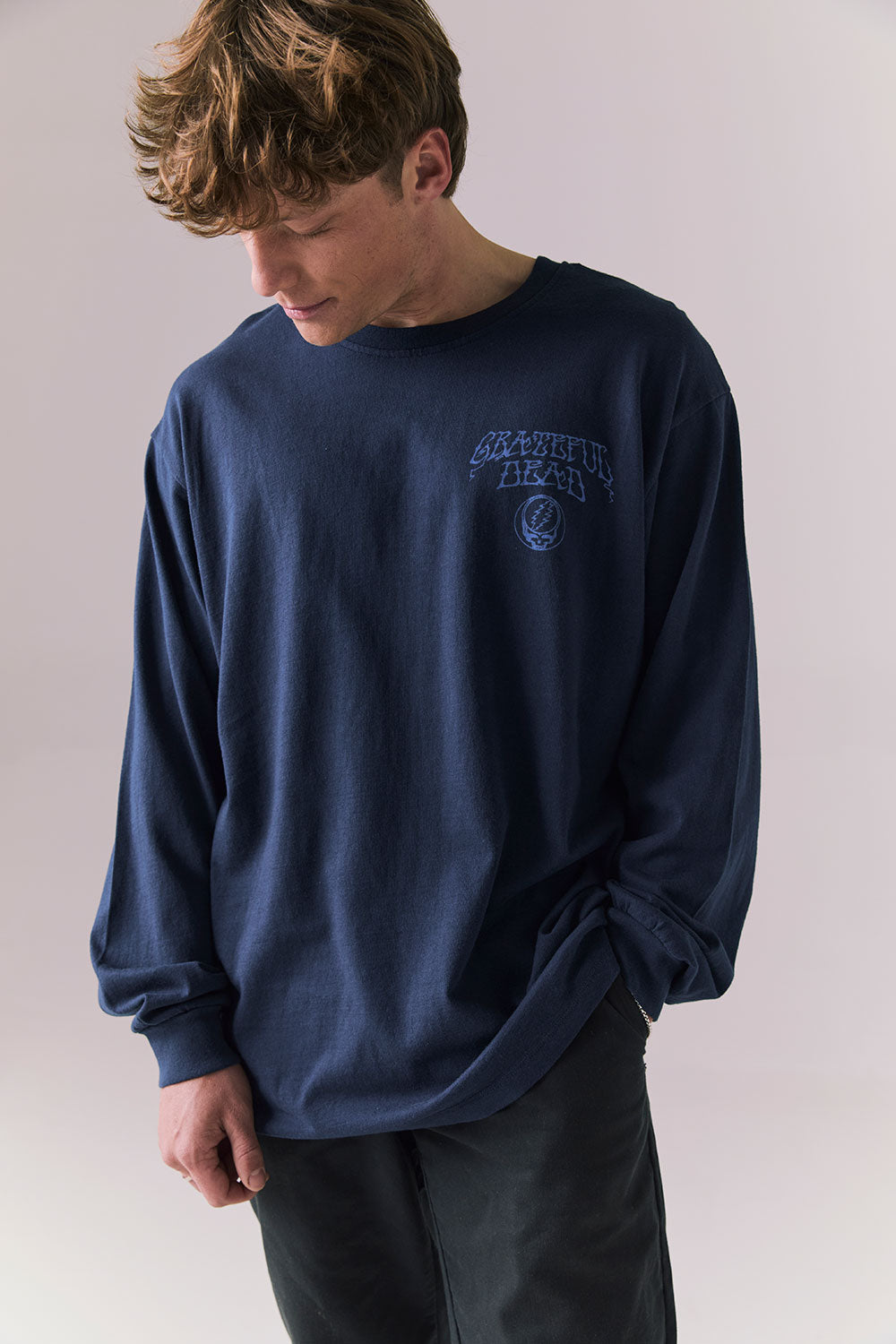 Front view of long sleeve tee in Dark and Stormy Blue with subtle Stealie skull design.