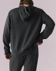 Back view of Bolt Black Hoodie with clean tonal finish.