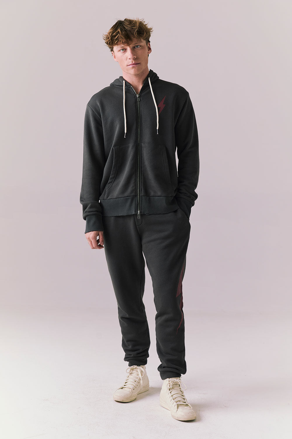 Full body view of model in Bolt Black Jogger Pants with matching hoodie.