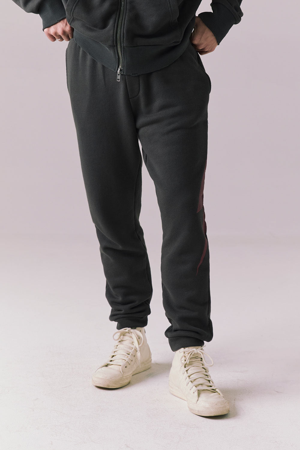 Front view of Bolt Black Jogger Pants with tonal lightning bolt design.