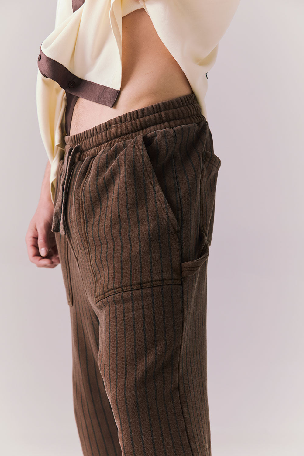 Side angle of Pinstripe Pants showing tapered leg and vintage stripe.