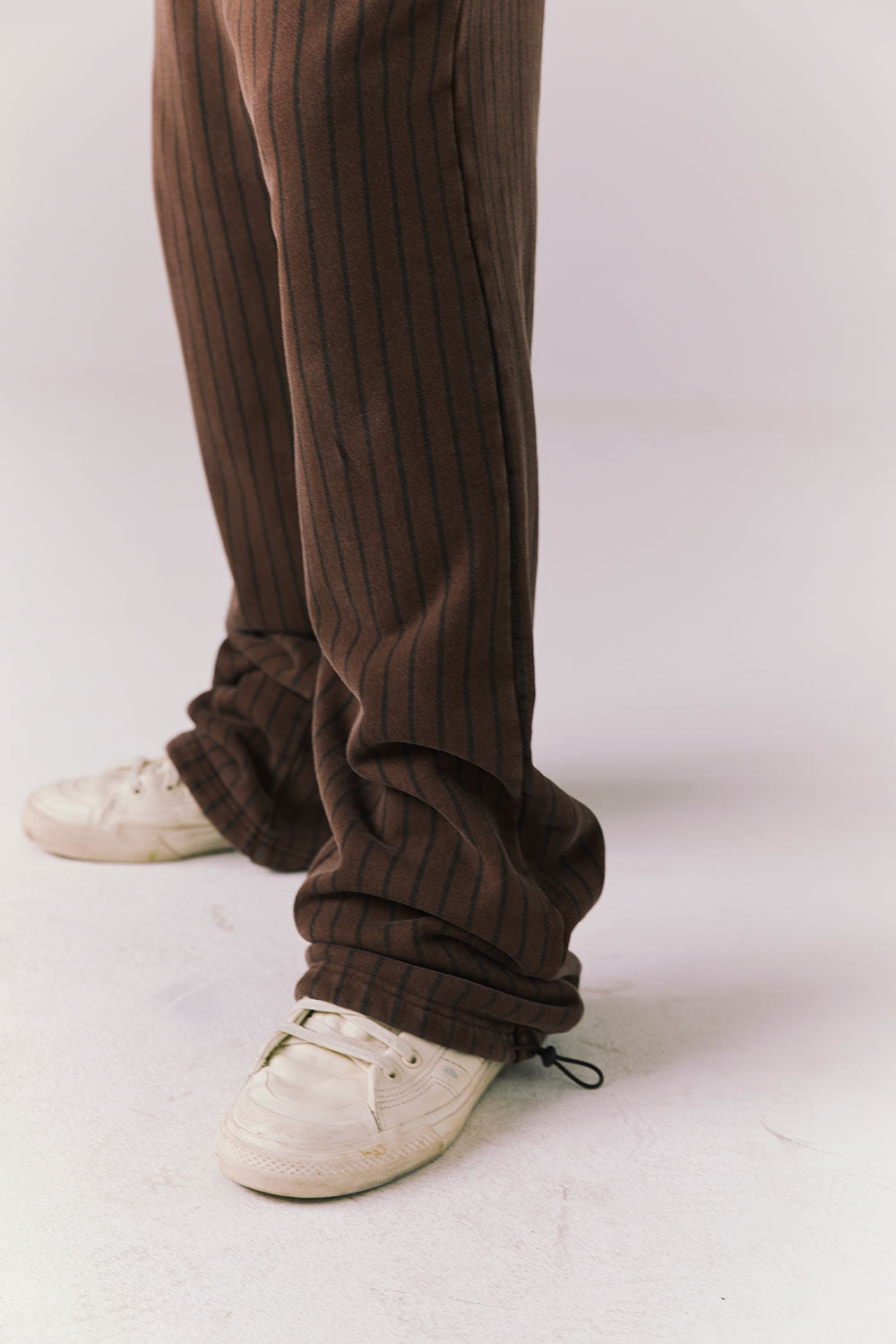 Side angle of Pinstripe Pants showing tapered leg and vintage stripe.
