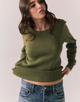 Front view of Varsity Star Sweater in bronze green with slouchy fit and twin arm stripes against a plain background