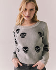 Front view of Tossed Skulls Long Sleeve sweater in Heather Grey with allover black skull motif and fitted silhouette against a plain background