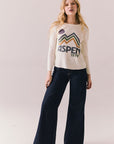Full body view of model in Aspen 1979 Long Sleeve in white
