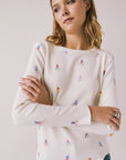 Woman wearing Chaser's Allover Skiers with small colorful patterns on a light gray background