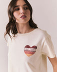 Front view of Lake Tahoe Ombre Tee in starry white with soft gradient fade, heart-shaped graphic design, and relaxed silhouette on a plain background