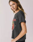 Side view of woman wearing Chaser’s Willie Nelson Willie Christmas Tee showing vintage-style holiday print detail on a plain background (licensed band collaboration)