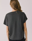 Back view of woman wearing Chaser’s Willie Nelson Willie Christmas Tee on a plain background (licensed band collaboration)