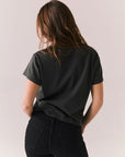 Back of black Stones tee with clean silhouette and hemline detail.