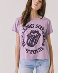Front view of woman wearing Chaser’s The Rolling Stones ’78 Tour Amethyst Purple Tee on a plain background
