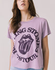 Front view of woman wearing Chaser’s The Rolling Stones ’78 Tour Amethyst Purple Tee on a plain background