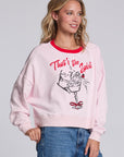 Model wearing Chaser's Champagne Party Pullover in Pinky pink with festive champagne glass artwork, angled view