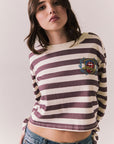 Front view of The Rolling Stones Rugby Stones Logo Long Sleeve with red and white stripes, cropped fit, and tongue logo graphic against a plain background