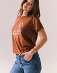 Side view of Wild Horses tee showing color tone and hemline.