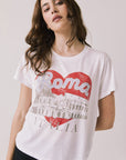 Front view of woman wearing Chaser's white Italian graphic tee with red heart, the Colosseum, and “Roma Italia” text on a light background