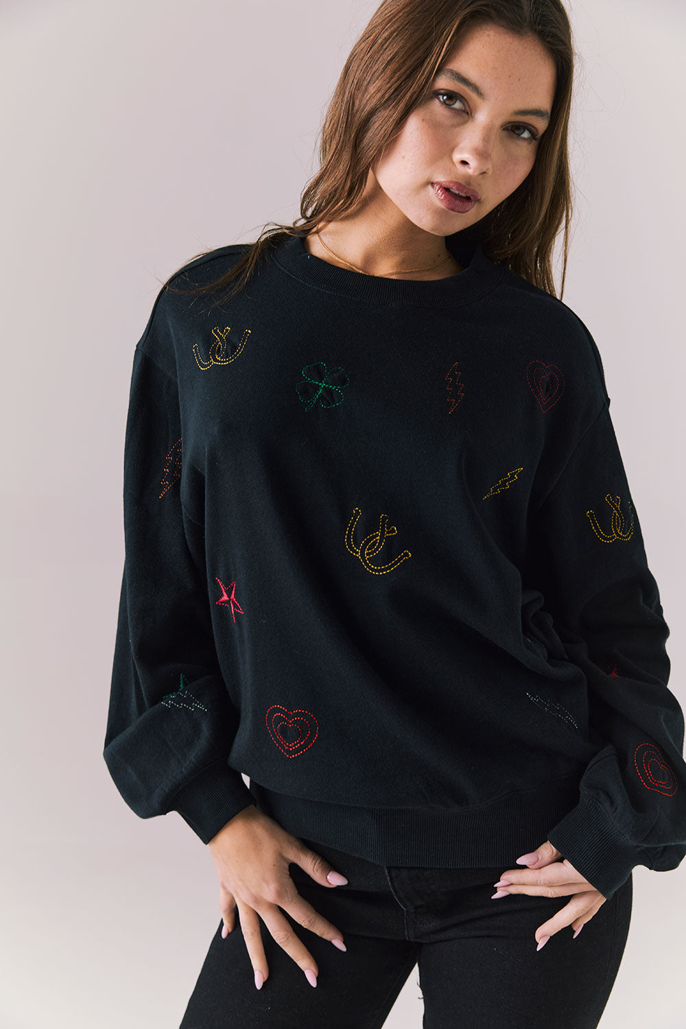 Front view of model wearing Allover Icons Long Sleeve in black