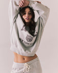Front view of NYC Stars Pullover in Heather Grey with bold chest lettering and black star sleeves against a plain background