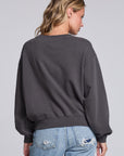Model wearing Chaser's Grateful Dead 'Tis the Season Pullover in Fresh Gravel with colorful Grateful Dead holiday artwork, back view