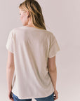 Back view of The Beatles Ticket Stub Collage Tee in Starry White with vintage ticket graphic and classic band logo against a plain background