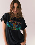 Black vintage-style graphic tee with Journey tape deck artwork and relaxed fit.