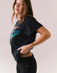Black vintage-style graphic tee with Journey tape deck artwork and relaxed fit.