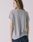 Back view of the Chaser Woodstock 1969 New York Tee in Heather Grey showing a clean solid back and easy everyday fit