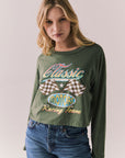 Front view of womens wearing Chaser's Classics Motors washed bronze green long sleeve with retro graphic on a plain background