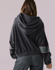 Back view of model wearing the Halftime fleece pullover hoodie in True Black with ‘HALFTIME’ chest graphic, against a plain background.