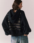 Back view of The Grateful Dead We Are Everywhere Hoodie in True Black with cropped boxy fit and skull graphic made from stars and zodiac signs against a plain background