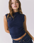 Close up front view of the Chaser Hailey Navy Top highlighting the smooth stretch fabric and refined neckline detail