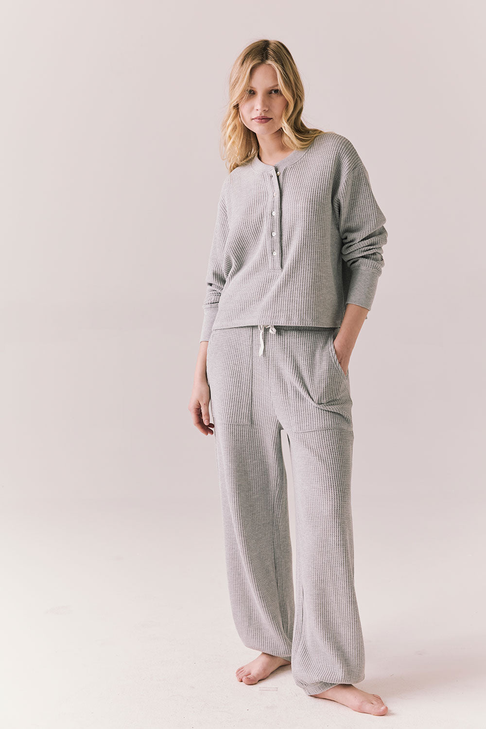Full front view of Thayne cropped thermal henley top in Heather Grey with 3/4 button placket and ribbed texture and matching Billy Joggers against a plain background
