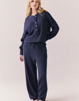 Full front view of Thayne cropped thermal henley top in Midnight Blue with 3/4 button placket and ribbed texture with matching Billy Joggers against a plain background