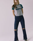 Full body view of the Chaser Sportiva Heather Grey Tee styled casually with denim for an everyday look