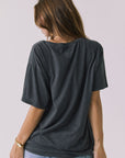 Back view of the Chaser Willie Nelson On The Road Again Tee in Vintage Black showing a clean solid back with relaxed drape