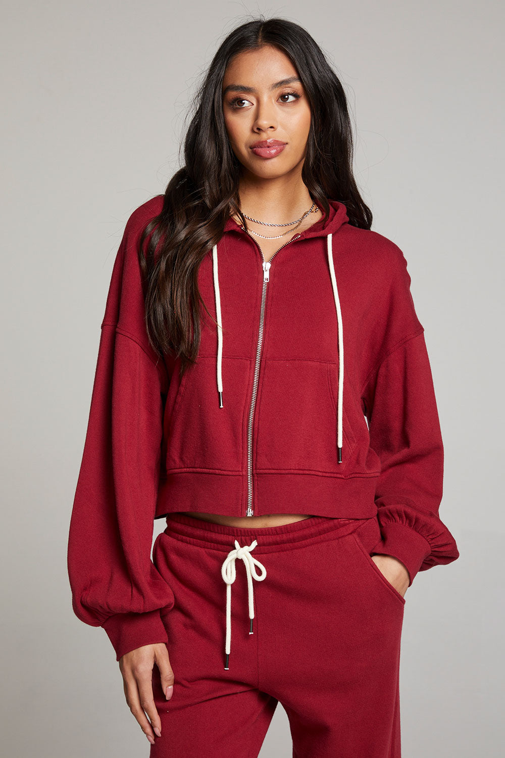 Front view of model wearing Abilenee Blood Red Zip Up Hoodie with cropped hem and full-zip closure against a plain background