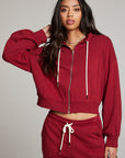 Front view of model wearing Abilenee Blood Red Zip Up Hoodie with cropped hem and full-zip closure against a plain background