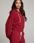 Side view of model wearing Abilenee Blood Red Zip Up Hoodie with cropped hem and full-zip closure against a plain background
