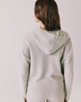 Back view of woman wearing Chaser’s Hazen Heather Grey Pullover on a white background