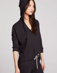 Side view of model wearing 3/4 Sleeve Split Side Licorice Dolman Hoodie in black showing relaxed fit and split-side detail on plain background and the hoodie up