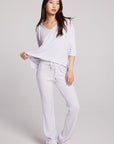 Full body view of model wearing 3/4 Sleeve Split Side Light Heather Grey Dolman Hoodie with dolman sleeves and split-side hem on plain background with matching joggers