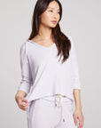 Front view of model wearing 3/4 Sleeve Split Side Light Heather Grey Dolman Hoodie with dolman sleeves and split-side hem on plain background with matching joggers