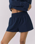 Chaser Durango Navy Shorts shown from the front with a relaxed fit elastic waistband and lightweight drape that hits mid thigh