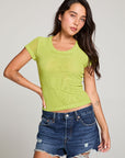 Front view of model wearing the 90’s Chartreuse Baby Tee in bright green with scoop neck and fitted cropped cut and cut off denim against a plain background