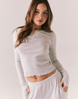 Heather grey ribbed long sleeve top with thumb holes and fitted shape.