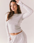 Heather grey ribbed long sleeve top with thumb holes and fitted shape.