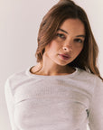 Heather grey ribbed long sleeve top with thumb holes and fitted shape.