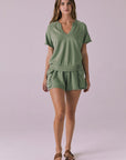 Model wearing the Chaser Cheyenne Meadow Green Pullover styled with matching Rileyy Meadow Green Shorts for a coordinated lounge look